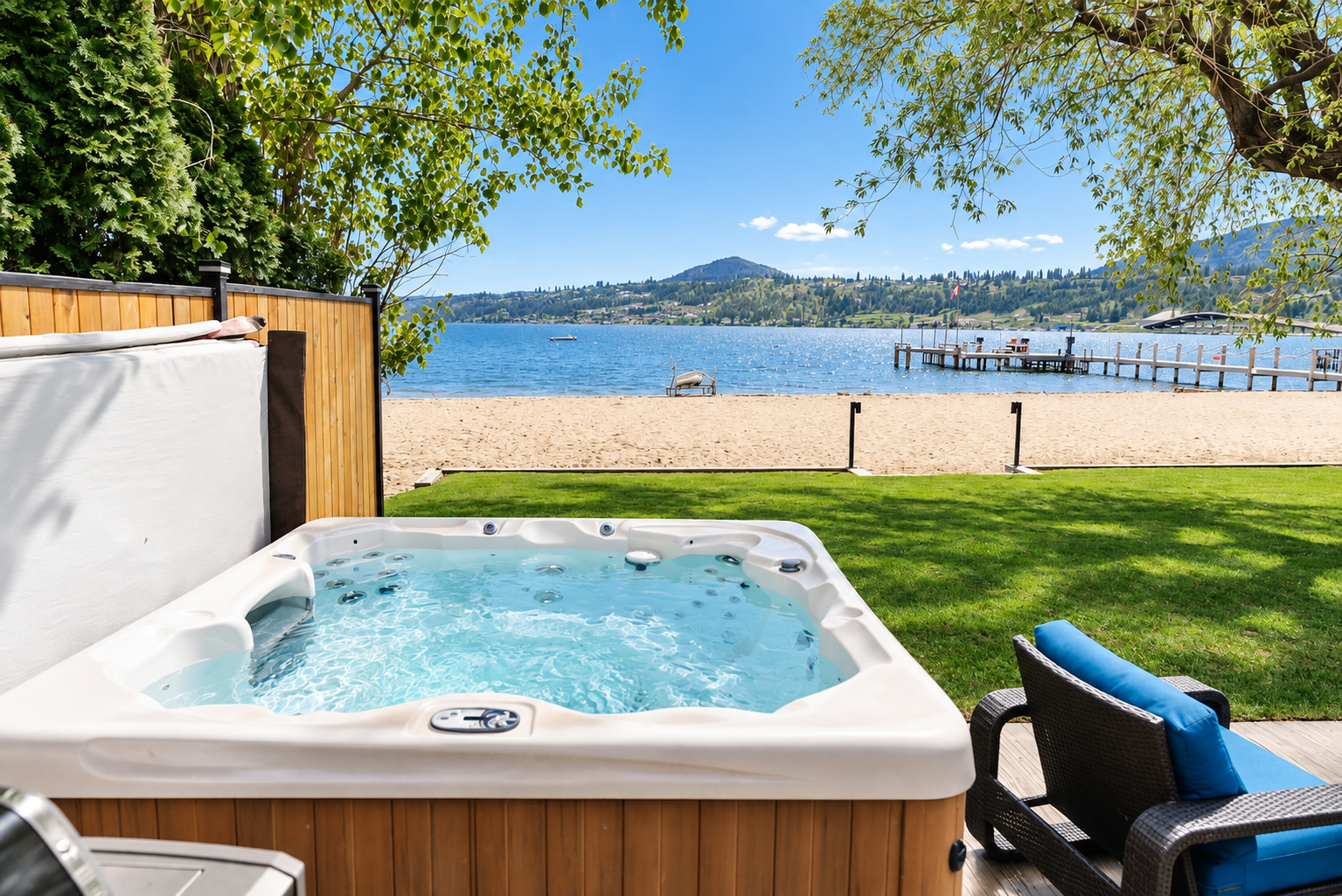 Private hot tub overlooking Okanagan Lake on a sunny day